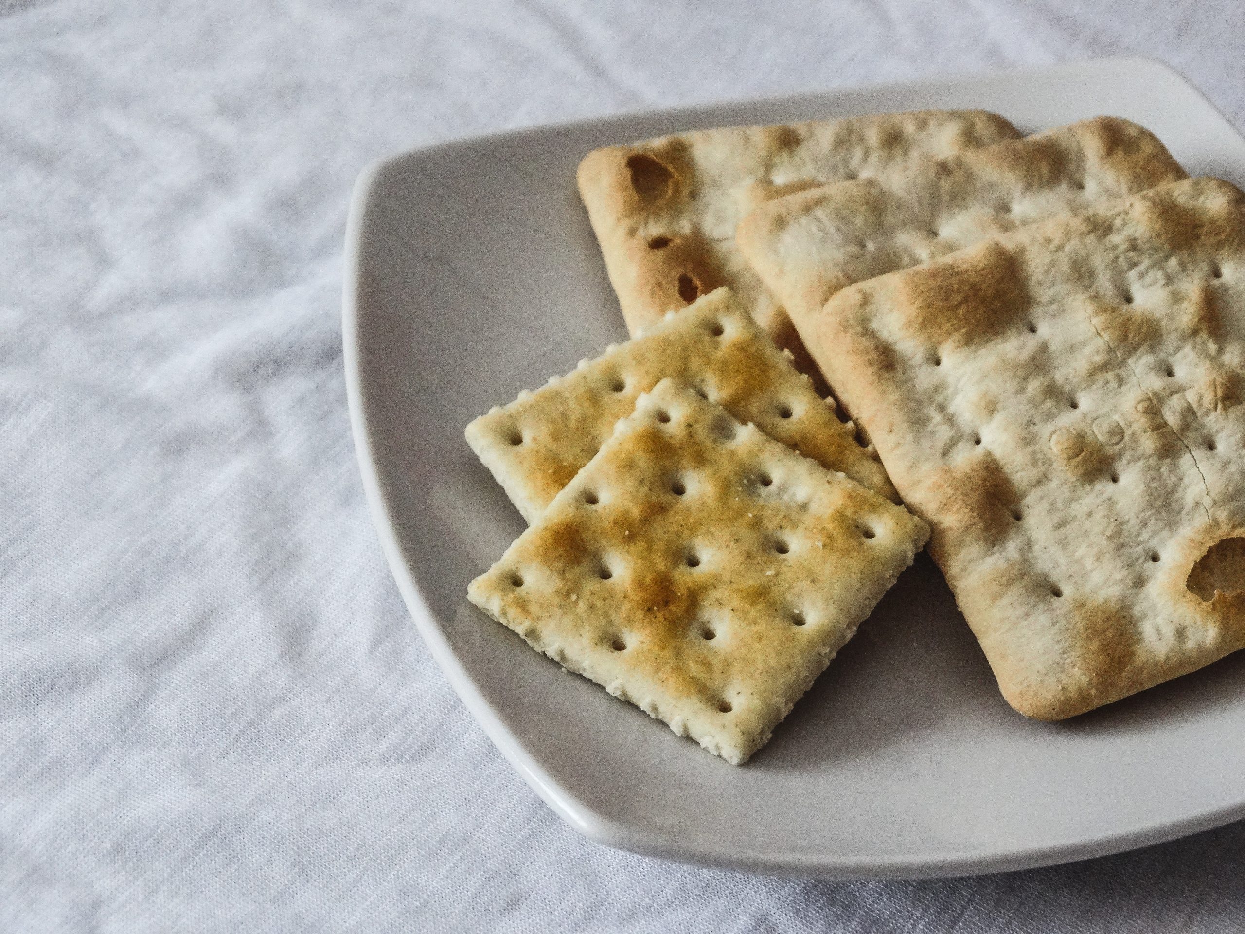 saltine crackers on a white plate